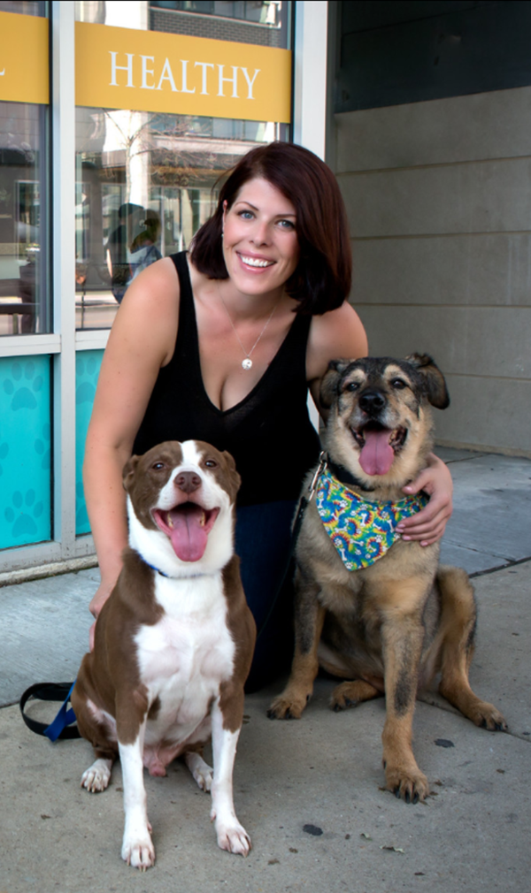 team member with two dogs